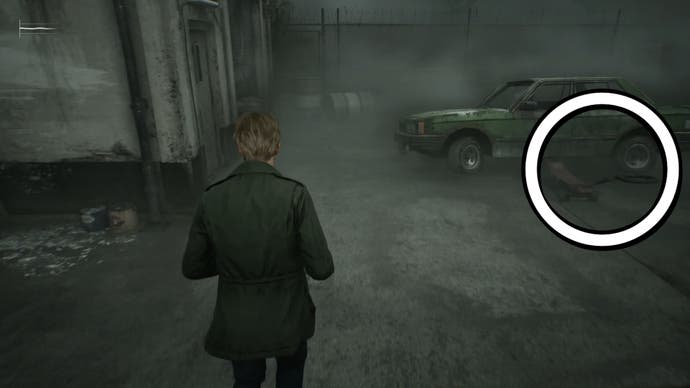 White circle showing the Garage Jack Lever being used on a car in Silent Hill 2.