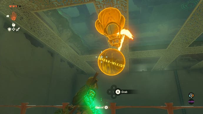 Link standing near a hot air balloon that has a metal ball attached to it in the Sinakawak Shrine.