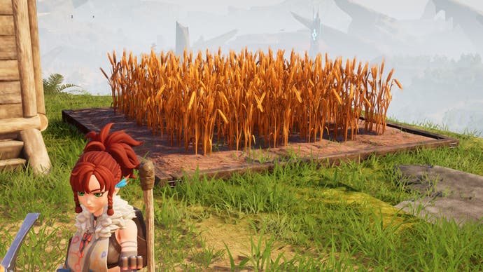 A red-haired Palworld character standing by a Wheat Plantation.