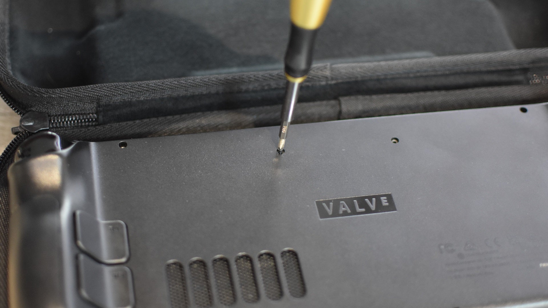 Step 10 of how to install an SSD in a Steam Deck: replace the back cover, including all its screws. - 17