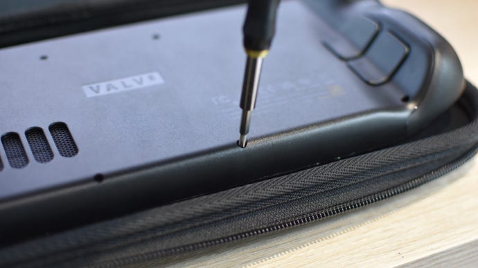 Step 2 of how to install an SSD in a Steam Deck: using an appropriate mini-screwdriver, remove all the screws on the rear of the Steam Deck.