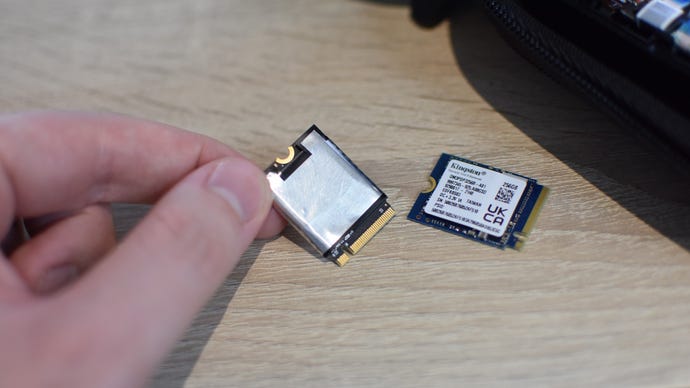 Step 7 of how to install an SSD in a Steam Deck: remove the protective sleeve from the old SSD and apply it to the new one.