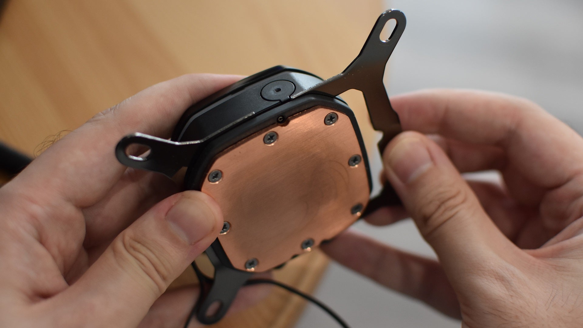 Step 2 of how to install a CPU liquid cooler: assemble the pump mount.