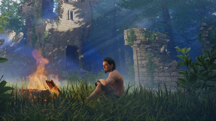 A shirtless lone male character sitting by a lit campfire in a ruin in Enshrouded.