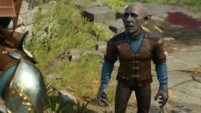 A drow custom character in mis-matched armour speaking with a deep gnome in a grassy area with a blood pool on the path behind them.