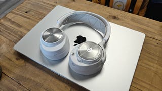 steelseries arctis nova pro wireless in white - headset on laptop