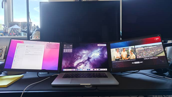 monduo 16 being used on a desk, in the shadow of a larger 32-inch monitor for scale