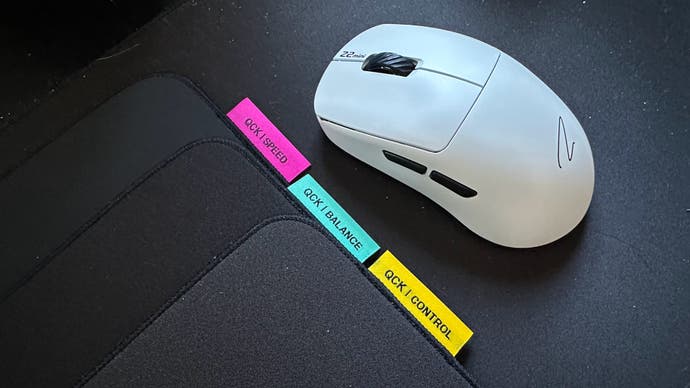 Steelseries QCK performance mouse pad next to the mouse