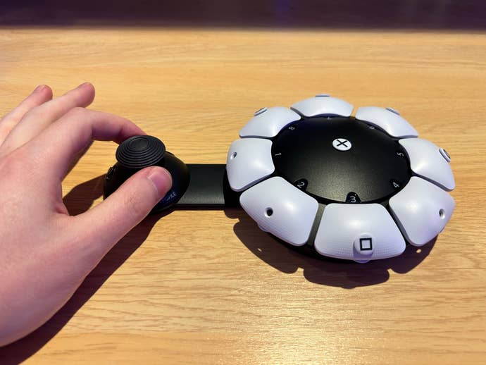 Photo of the Access controller with the stick pulled out and held