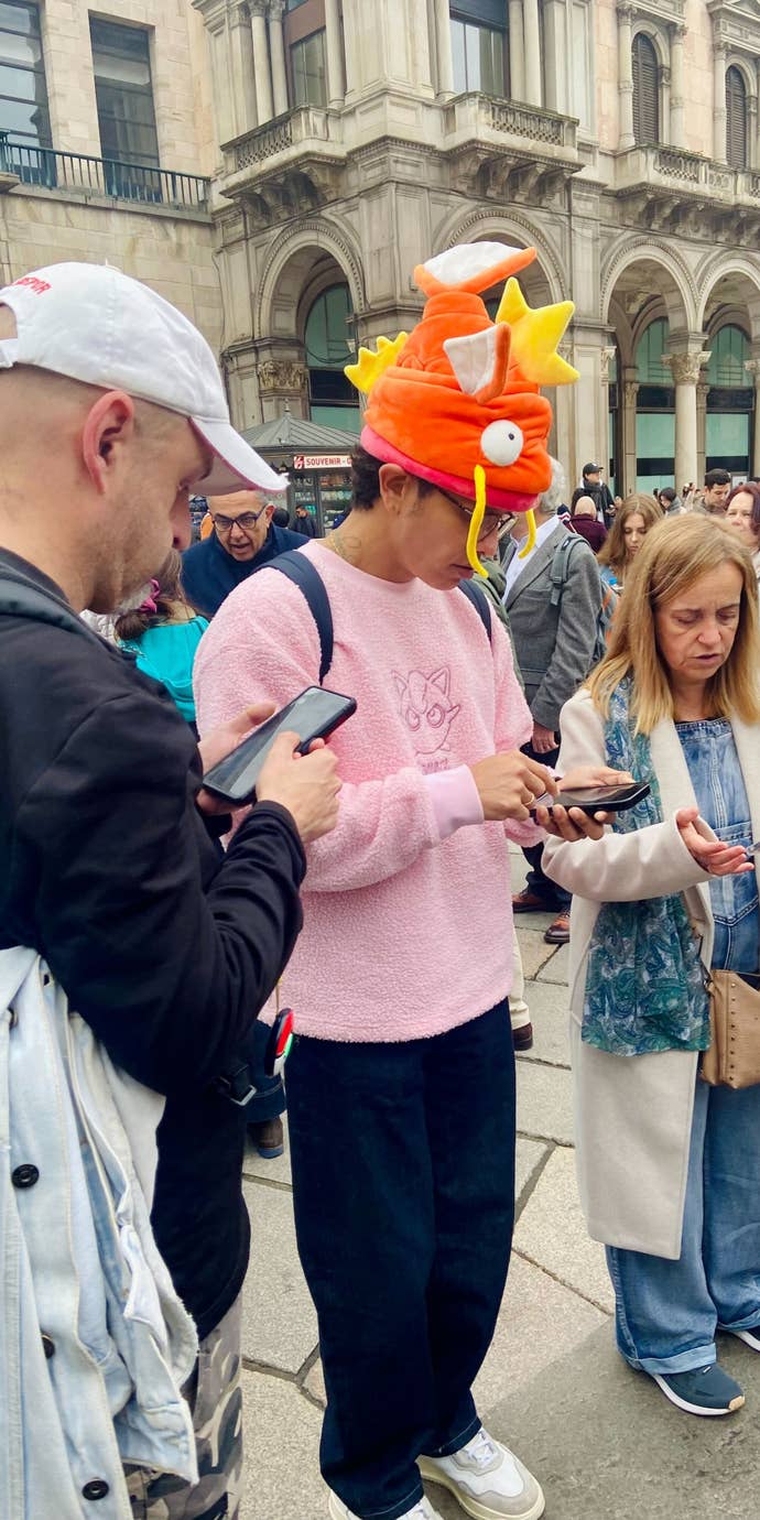 A Pokémon Go player wearing a magikarp hat.