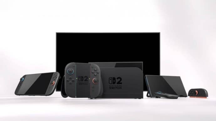 Nintendo Switch 2 console in front of a TV screen surrounded by different controllers