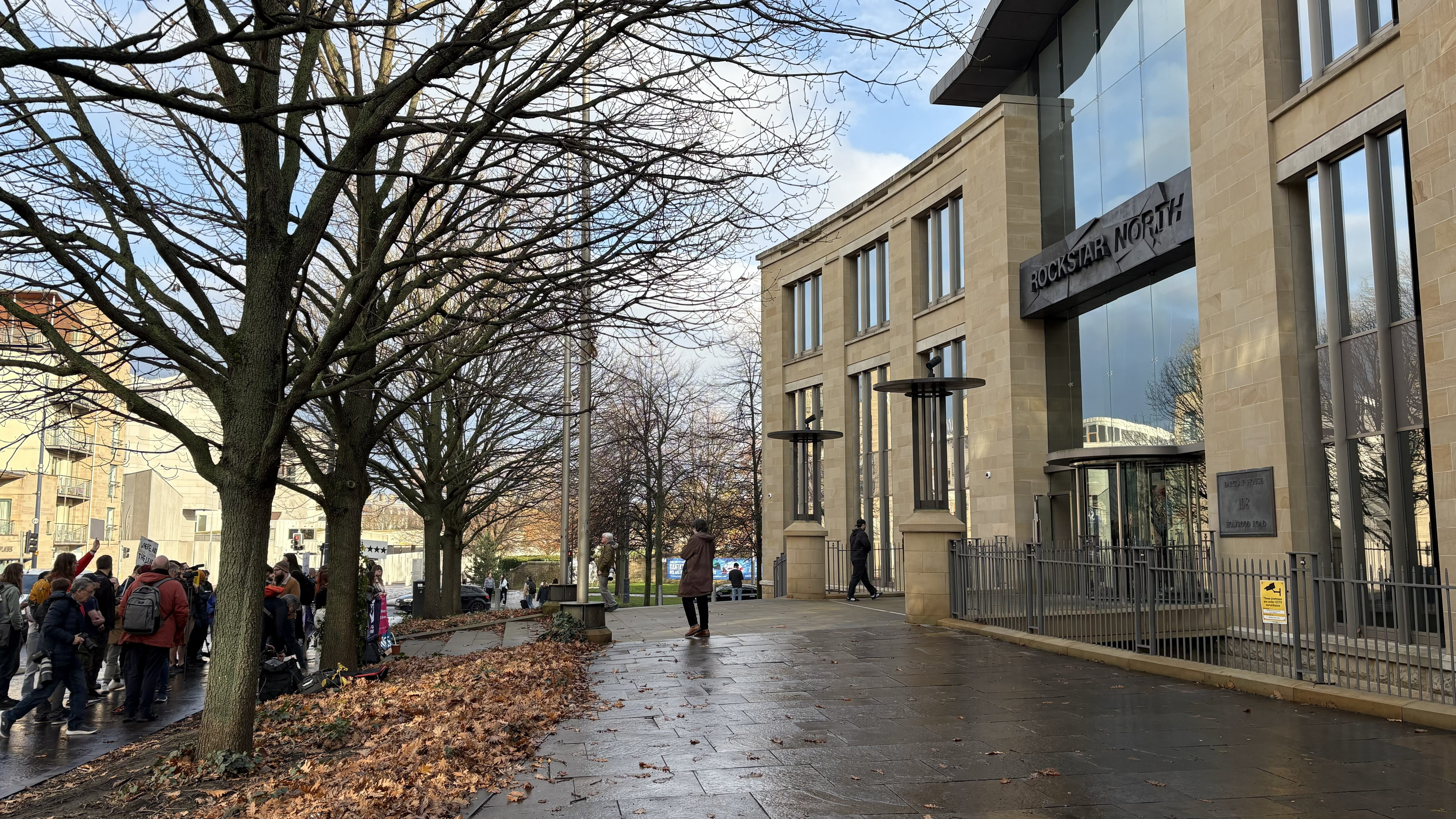 The street in front of Rockstar North's offices in Edinburgh, with a worker protest visible on the left.