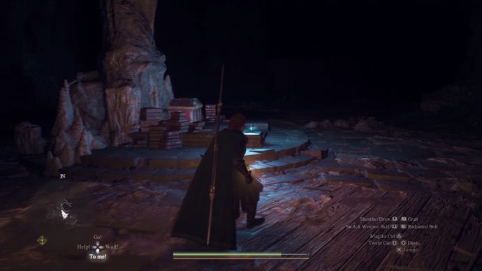 A player investigating a dark interior area in Dragon's Dogma 2