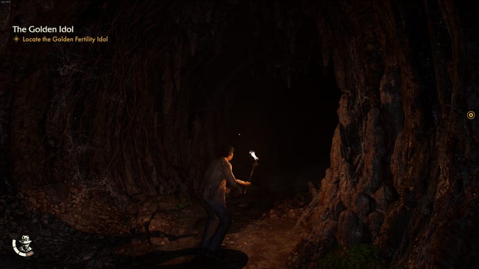Exploring a dark cave in Indiana Jones and the Great Circle.