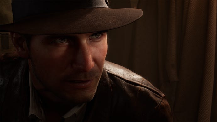 A shadowy close-up of Indiana Jones in the Great Circle game