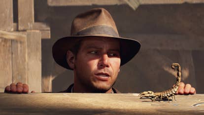 Indy pops his head over a ledge to see a scorpion in Indiana Jones and the Great Circle