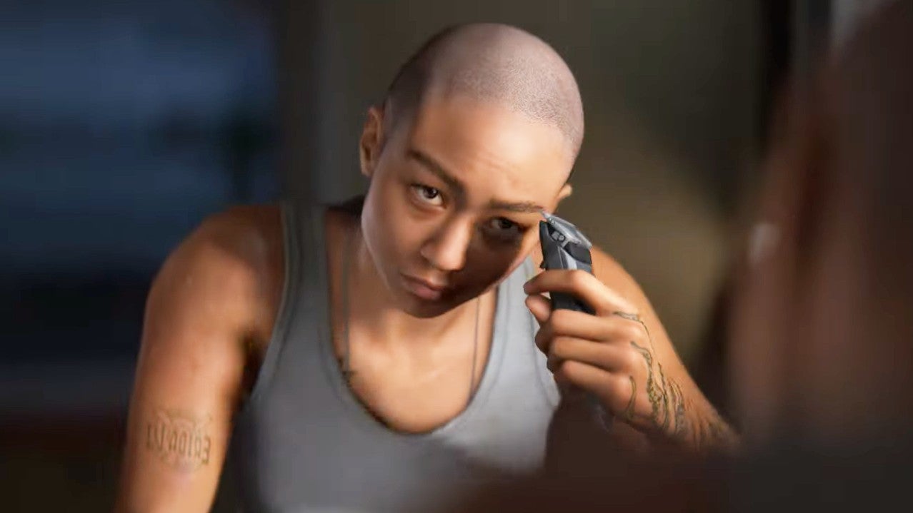 Intergalactic The Heretic Prophet trailer screenshot showing a female in a grey vest shaving her head