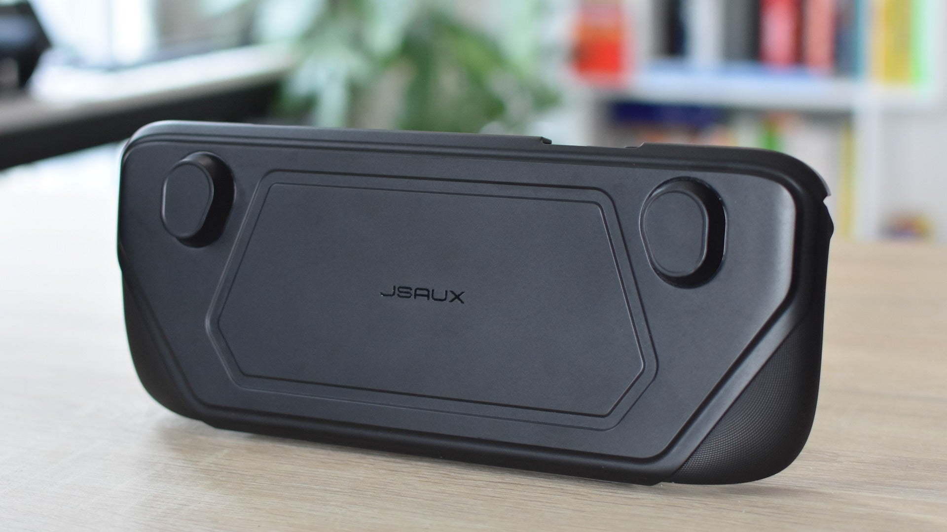 A Steam Deck inside the JSAUX ModCase, with its front cover attached,