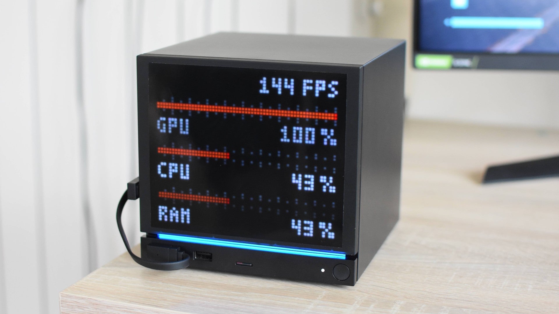 A JSAUX PixelMatrix faceplate on a Steam Machine, showing a its performance monitor display mode.