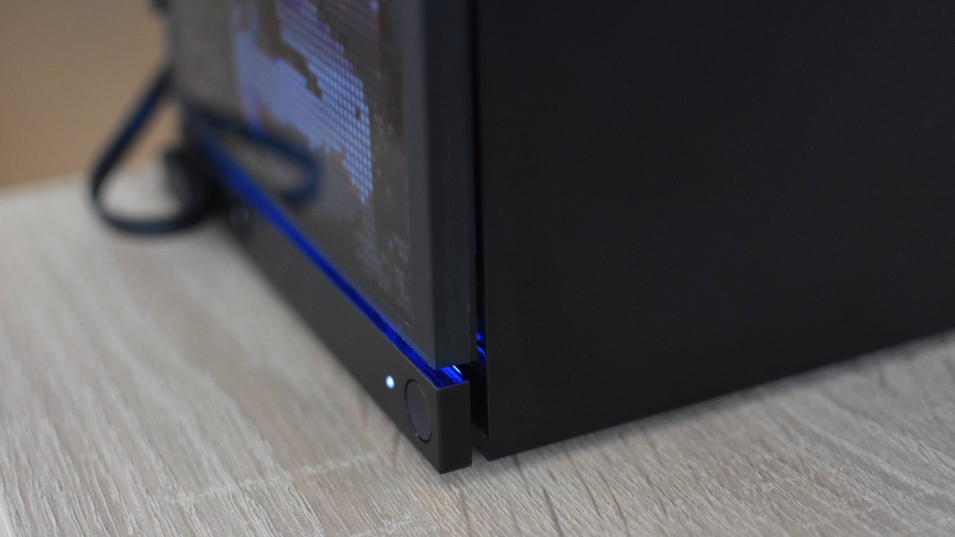 A close-up view of how the JSAUX PixelMatrix faceplate for the Steam Machine lines up with the Machine's own edges.