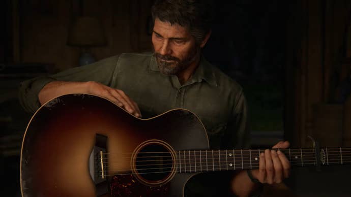 Joel holds his guitar in TLOU2