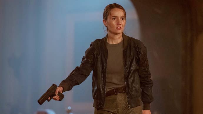Kaitlyn Dever as Abby holding a gun in The Last of Us season two