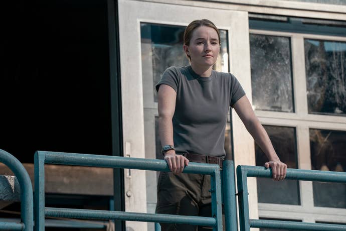 Kaitlyn Dever as Abby looks over the WLF stadium in TLOU season two finale