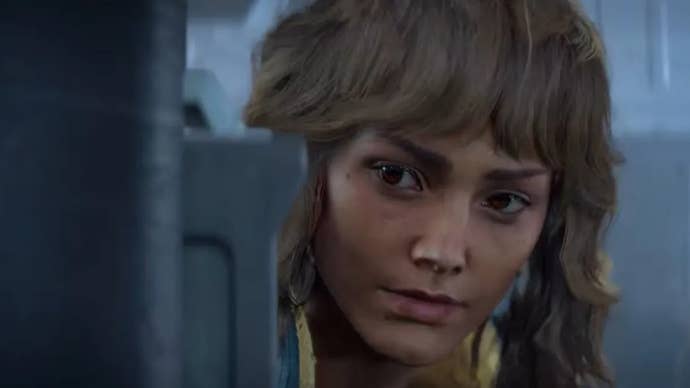 Kay Vess looks around a crate she is hiding behind in Star Wars Outlaws