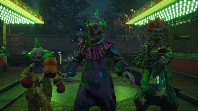 Three Killer Klowns are shown standing side by side in Killer Klowns from Outer Space The Game