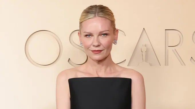 Kirsten Dunst in a chic strapless black dress