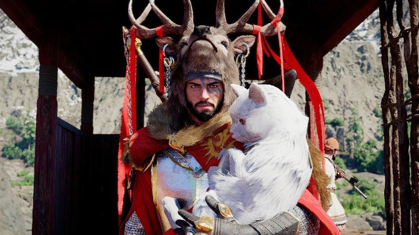 Kliff from Crimson Desert in a large stag like headdress holding a white creature in his arms