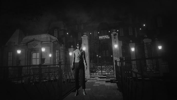 A woman in sunglasses stands outside a hotel gate  in Lorelei And The Laser Eyes