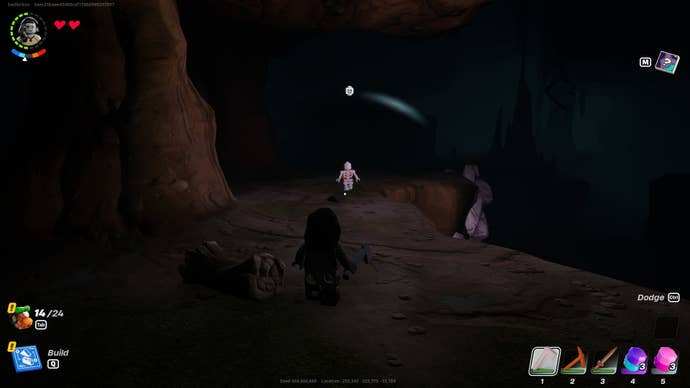 The player is inside a cave in LEGO Fortnite, near a skeleton