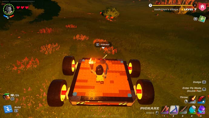 The player stands on a car built with dynamic foundations and wheels in LEGO Fortnite