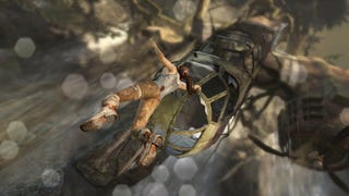 Lara Croft hangs onto a ruined plane in Tomb Raider