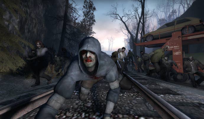 Hooded zombie crouches connected  bid     tracks successful  beforehand   of an undead horde successful  near  4 Dead screenshot.