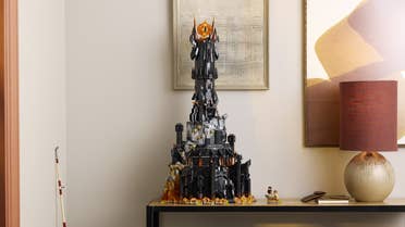 Lego The Lord of the Rings: Barad-dûr model on a side table next to a lamp.