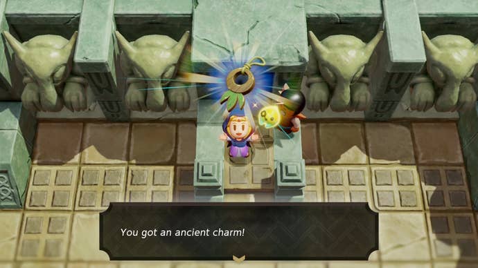 Zelda holding up the Ancient Charm accessory outside of the Eastern Temple in Zelda Echoes of Wisdom.