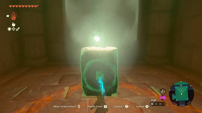Link using his Ultrahand ability to attach a mirror to a stone slab in the Lightning Temple’s Room of Natural Light.