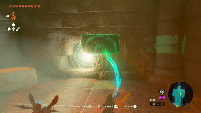Link using his Ultrahand ability to move stone slabs out of a wall and reveal a hidden light source in the Lightning Temple.