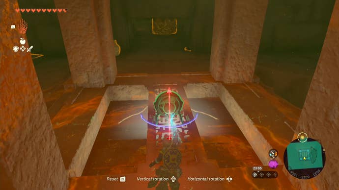 Link using his Ultrahand ability to move a mirror onto a bridge that’s over a light source in Tears of the Kingdom.