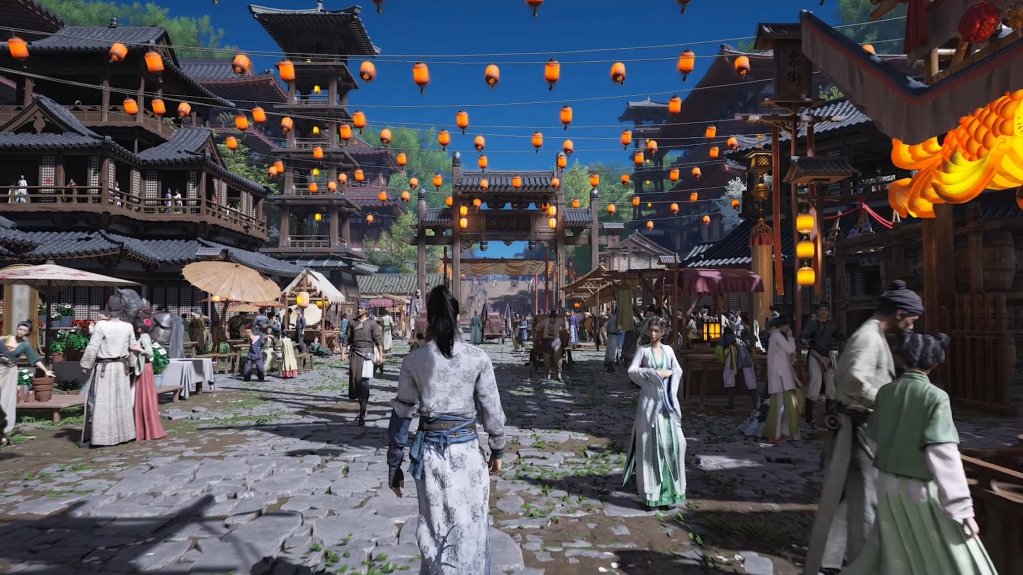 A lively city square in Where Winds Meet, featuring lanterns hanging from the tops of buildings and many people milling about. - 1
