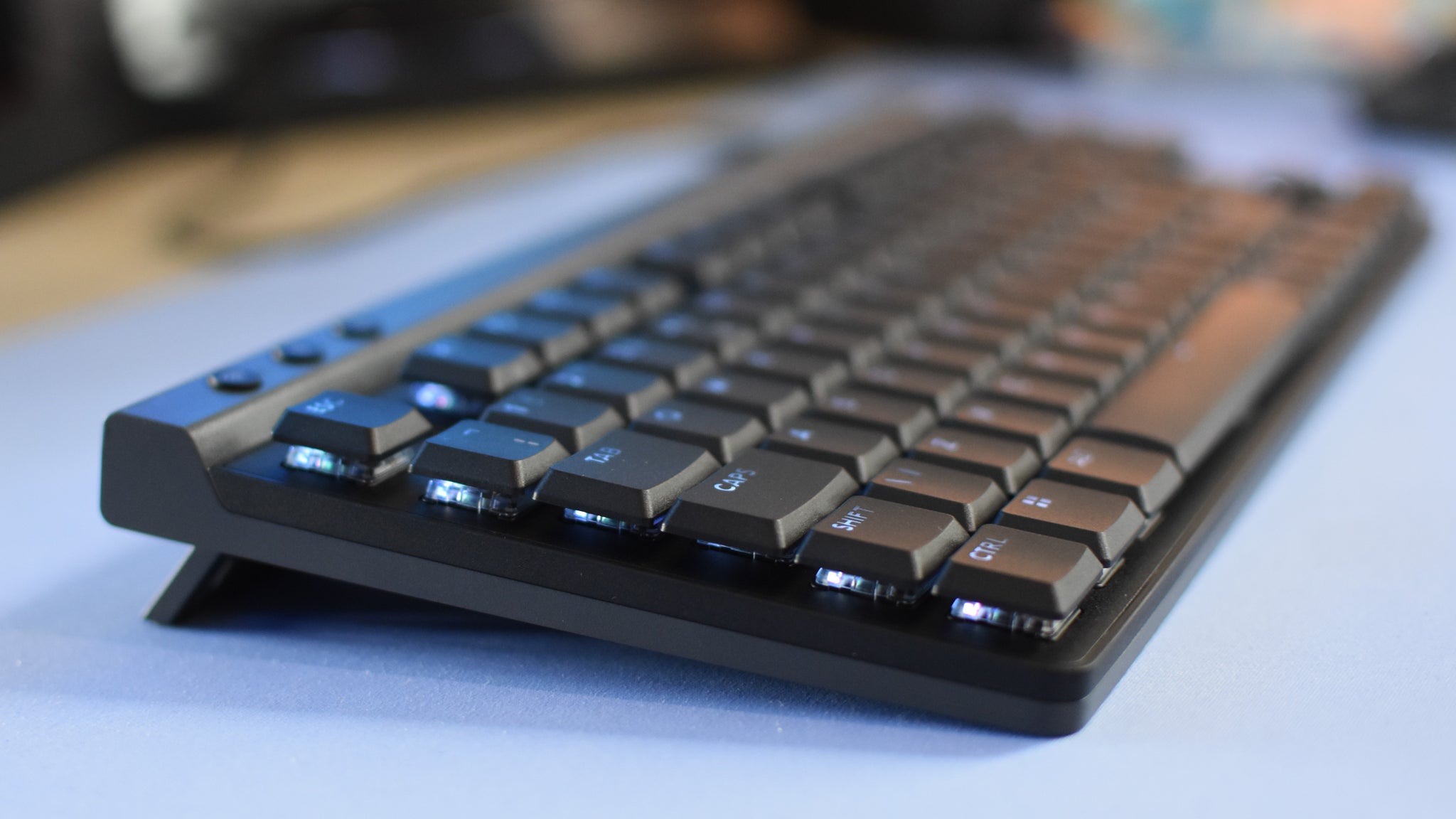 A side view of the Logitech G515 Lightspeed TKL gaming keyboard, showing its low-profile design. - 3