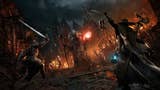 Lords of the Fallen promo screenshot showing wizard character with staff in middle of a city at night full of ghouls