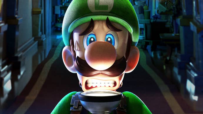 Luigi looks scared as he holds a torch up to his face in Luigi’s Mansion 3