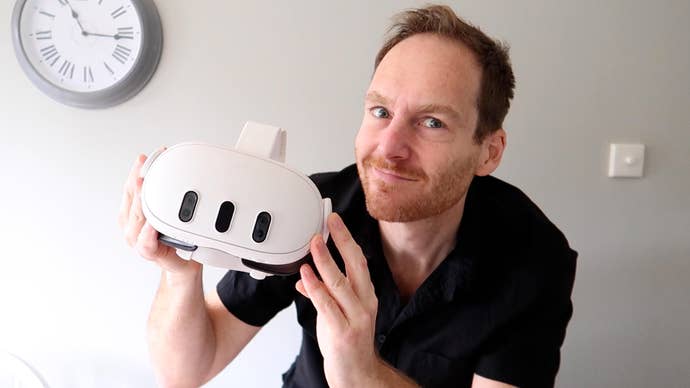 Ian Higton holding a Meta Quest 3 headset and looking all smug and stuff.
