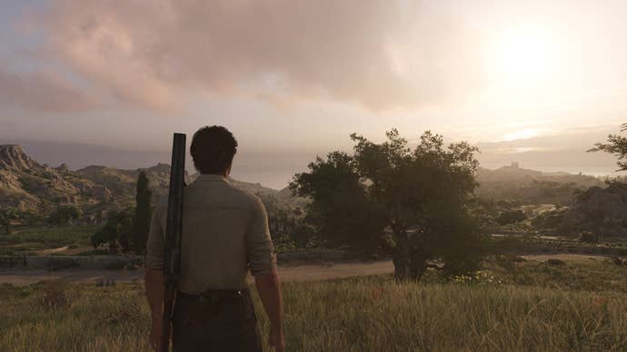 A masculine character walks across a field at dusk, with a shotgun slung over their shoulder.