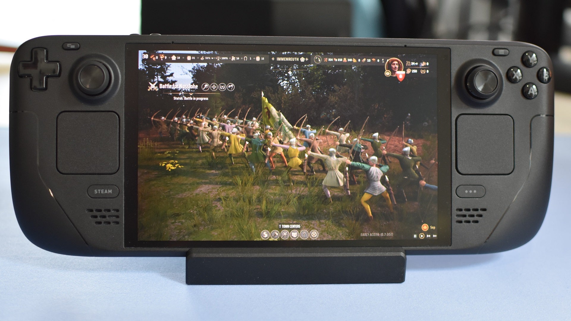 An enemy unit of archers takes aim in Manor Lords, running on a Steam Deck OLED.