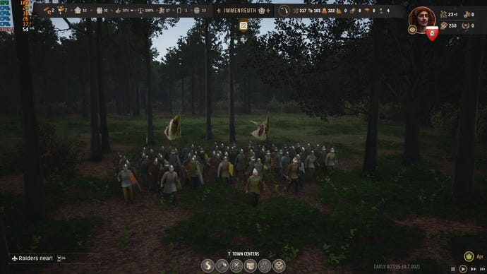 An army unit marches through the woods in Manor Lords.