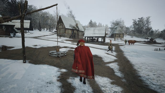 Taking a walk through a snowy village in Manor Lords' third-person mode.